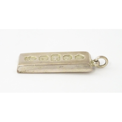 656 - A silver pendant of ingot, hallmarked Sheffield 1977 with Jubilee mark, maker Carrs of Sheffield. Ap... 