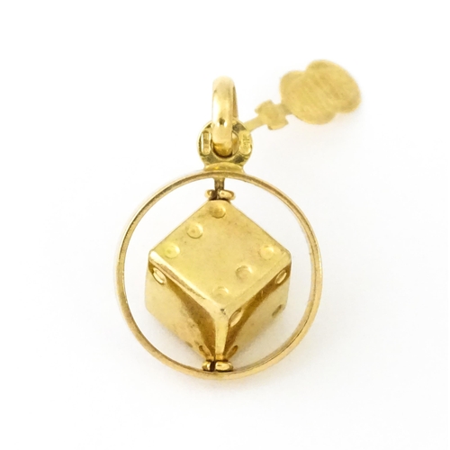 666 - An Italian 18ct gold pendant fob / charm with dice to centre, by Uno Aerre. Approx. 1