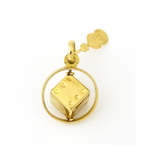 666 - An Italian 18ct gold pendant fob / charm with dice to centre, by Uno Aerre. Approx. 1