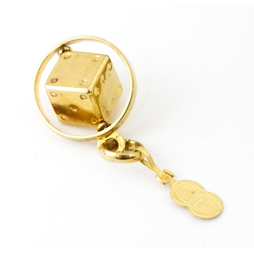 666 - An Italian 18ct gold pendant fob / charm with dice to centre, by Uno Aerre. Approx. 1