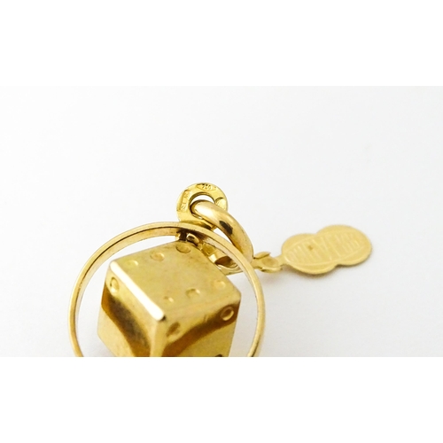 666 - An Italian 18ct gold pendant fob / charm with dice to centre, by Uno Aerre. Approx. 1