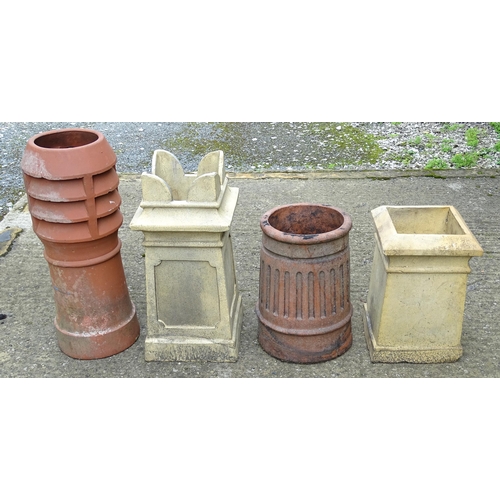 1334 - Four chimney pots, to include two terracotta and two stoneware examples, the largest approx 31