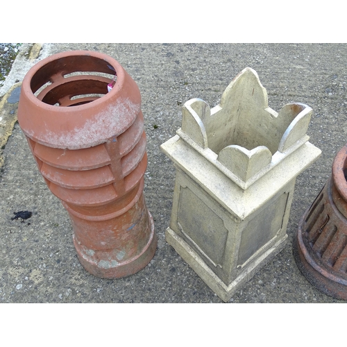 1334 - Four chimney pots, to include two terracotta and two stoneware examples, the largest approx 31