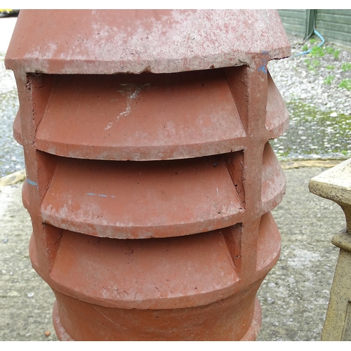 1334 - Four chimney pots, to include two terracotta and two stoneware examples, the largest approx 31