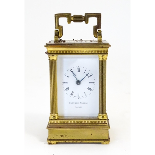 1401 - A Matthew Norman small brass carriage clock.  Approx 4 1/2