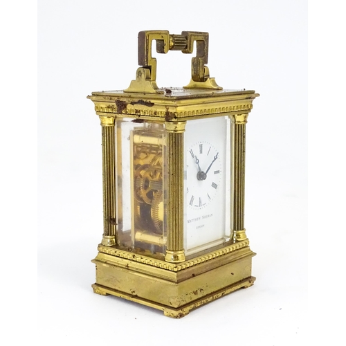 1401 - A Matthew Norman small brass carriage clock.  Approx 4 1/2