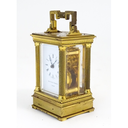 1401 - A Matthew Norman small brass carriage clock.  Approx 4 1/2