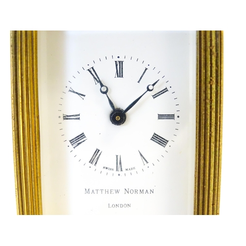 1401 - A Matthew Norman small brass carriage clock.  Approx 4 1/2