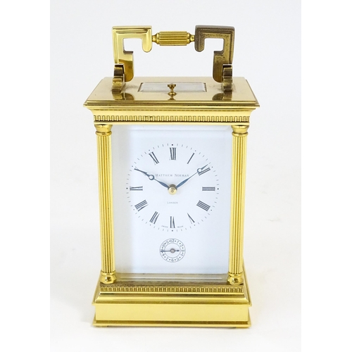 1402 - A brass cased repeater carriage clock,  the white enamel dial with Roman numerals and signed Matthew... 