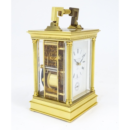 1402 - A brass cased repeater carriage clock,  the white enamel dial with Roman numerals and signed Matthew... 