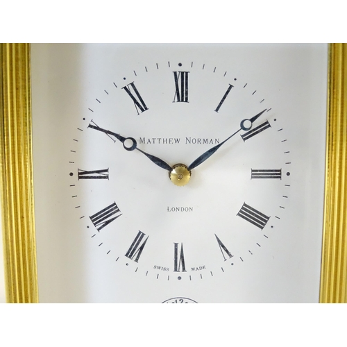 1402 - A brass cased repeater carriage clock,  the white enamel dial with Roman numerals and signed Matthew... 