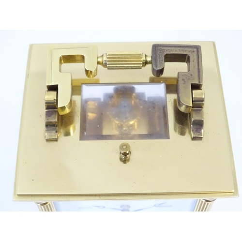 1402 - A brass cased repeater carriage clock,  the white enamel dial with Roman numerals and signed Matthew... 