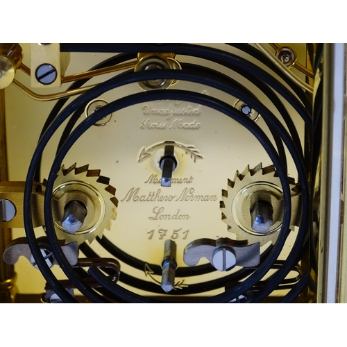 1402 - A brass cased repeater carriage clock,  the white enamel dial with Roman numerals and signed Matthew... 