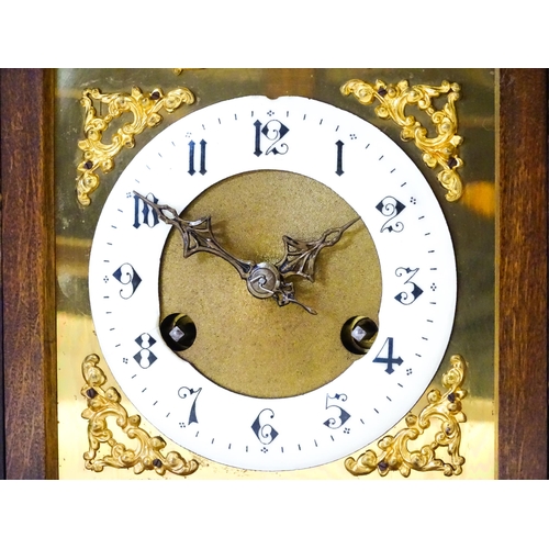 1404 - An early 20thC Junghans walnut cased mantle clock with enamel Arabic chapter ring,  the 8-day moveme... 