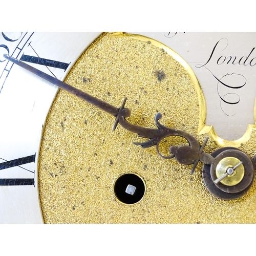 1405 - A late 18thC / early 19thC ebonised bracket clock. The silvered dial with strike/silent to the arch,... 