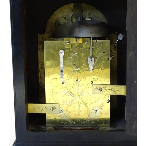 1405 - A late 18thC / early 19thC ebonised bracket clock. The silvered dial with strike/silent to the arch,... 