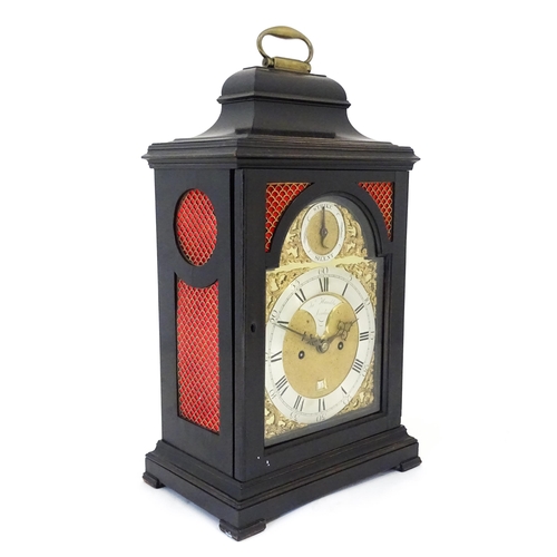 1405 - A late 18thC / early 19thC ebonised bracket clock. The silvered dial with strike/silent to the arch,... 