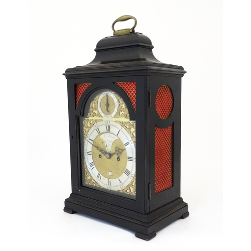 1405 - A late 18thC / early 19thC ebonised bracket clock. The silvered dial with strike/silent to the arch,... 