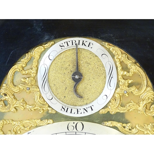 1405 - A late 18thC / early 19thC ebonised bracket clock. The silvered dial with strike/silent to the arch,... 