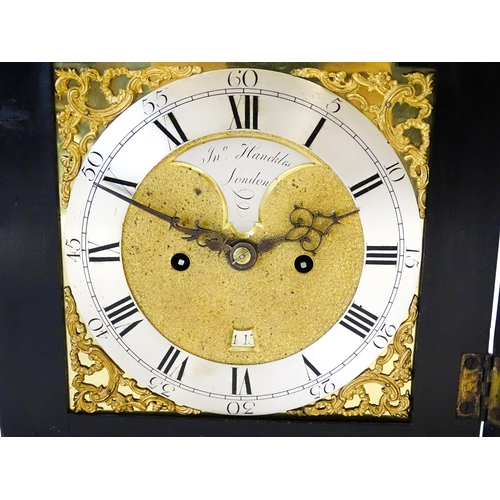 1405 - A late 18thC / early 19thC ebonised bracket clock. The silvered dial with strike/silent to the arch,... 