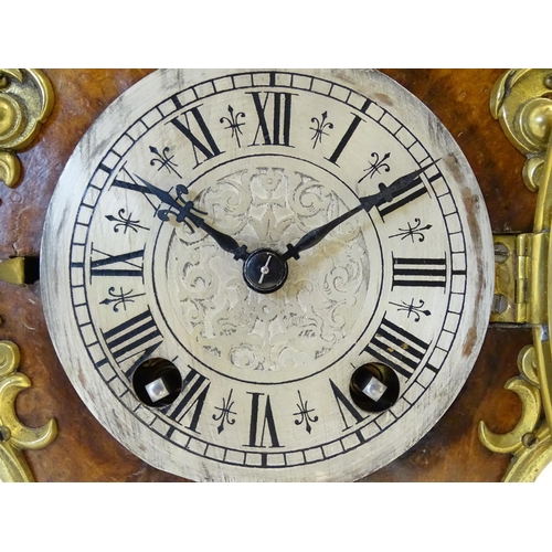 1410 - A late 19thC / early 20thC German walnut mantle clock with silvered dial having Roman chapter ring, ... 