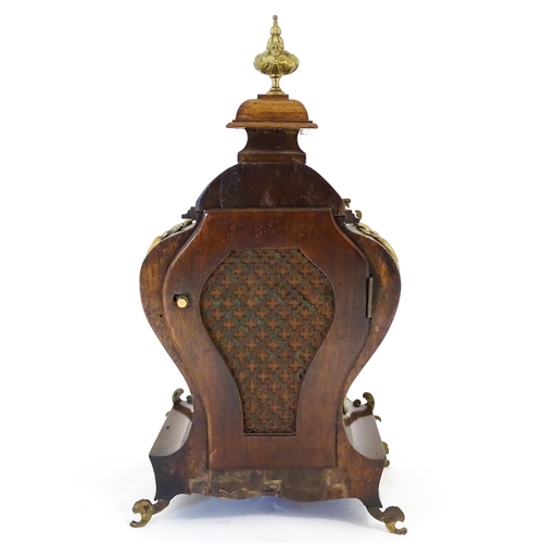 1410 - A late 19thC / early 20thC German walnut mantle clock with silvered dial having Roman chapter ring, ... 