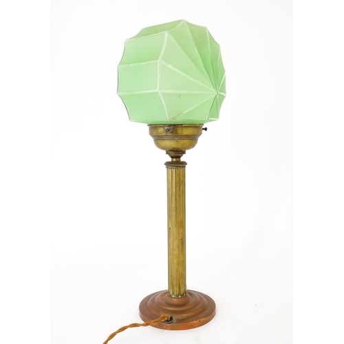 1423 - An Art Deco copper and brass table lamp with green glass shade. Approx. 18