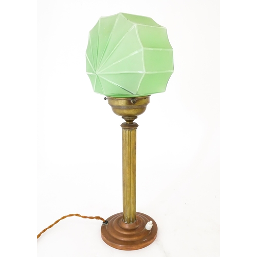 1423 - An Art Deco copper and brass table lamp with green glass shade. Approx. 18