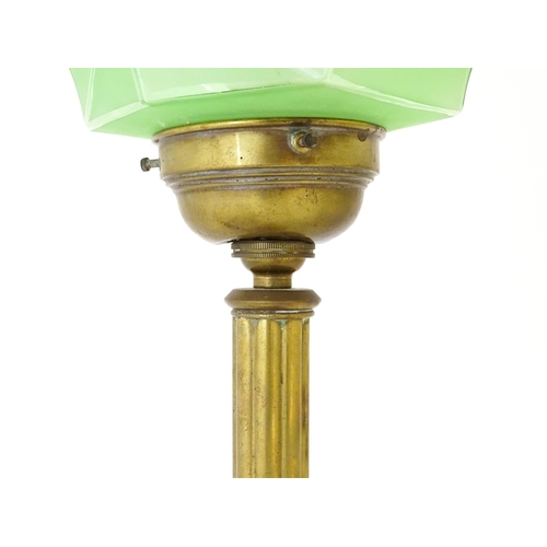 1423 - An Art Deco copper and brass table lamp with green glass shade. Approx. 18