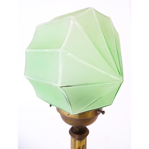 1423 - An Art Deco copper and brass table lamp with green glass shade. Approx. 18