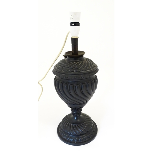 1426 - A 20thC cast table lamp of urn form. Approx. 18