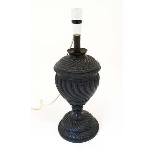 1426 - A 20thC cast table lamp of urn form. Approx. 18