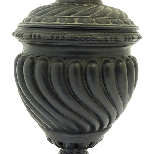 1426 - A 20thC cast table lamp of urn form. Approx. 18