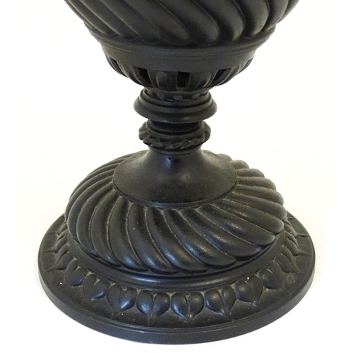 1426 - A 20thC cast table lamp of urn form. Approx. 18