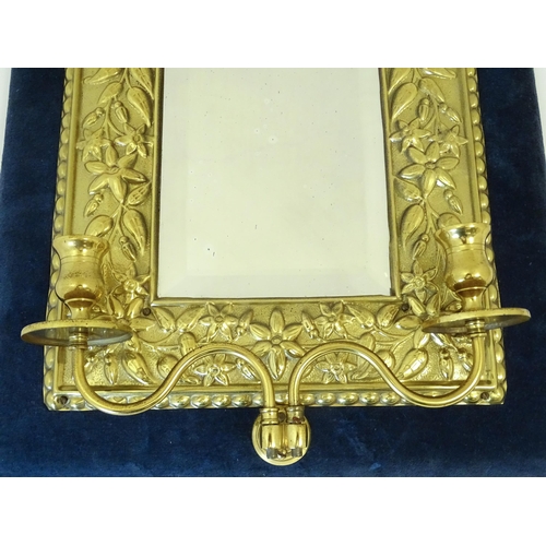 1427 - A 20thC girandole the bevelled mirror with brass and velvet surround, with twin branches lower. Appr... 