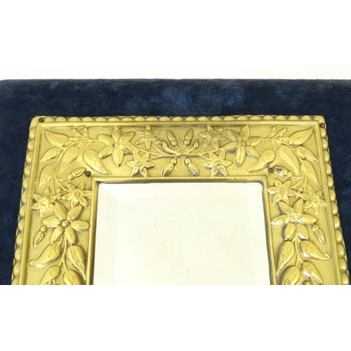 1427 - A 20thC girandole the bevelled mirror with brass and velvet surround, with twin branches lower. Appr... 