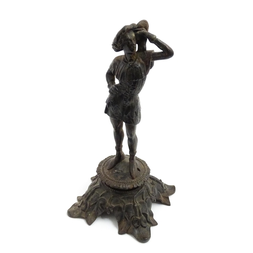 1002 - An early 20thC cast sculpture modelled as a young man, raised on an Art Nouveau base with foliate de... 