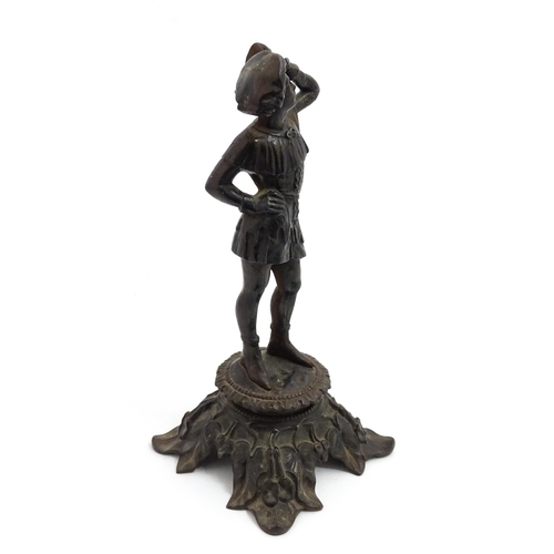 1002 - An early 20thC cast sculpture modelled as a young man, raised on an Art Nouveau base with foliate de... 