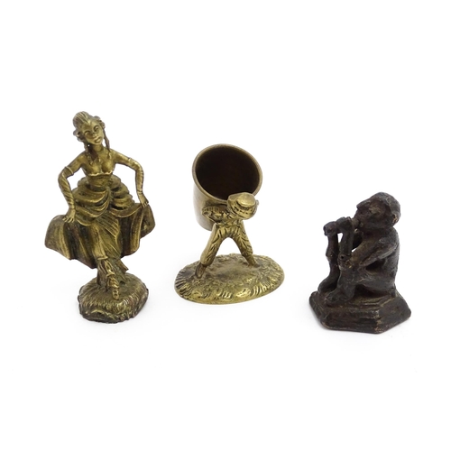 1010 - An Oriental cast model of a seated monkey, possibly a scroll weight. Together with a 20thC brass mat... 