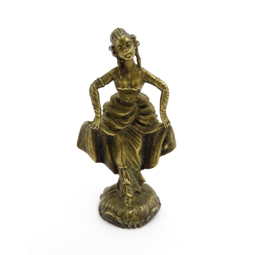 1010 - An Oriental cast model of a seated monkey, possibly a scroll weight. Together with a 20thC brass mat... 