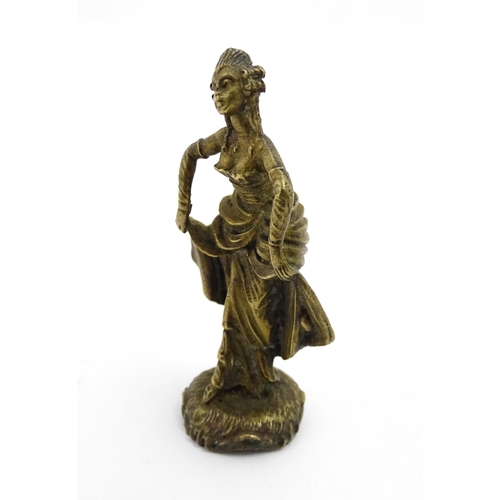 1010 - An Oriental cast model of a seated monkey, possibly a scroll weight. Together with a 20thC brass mat... 