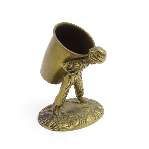 1010 - An Oriental cast model of a seated monkey, possibly a scroll weight. Together with a 20thC brass mat... 