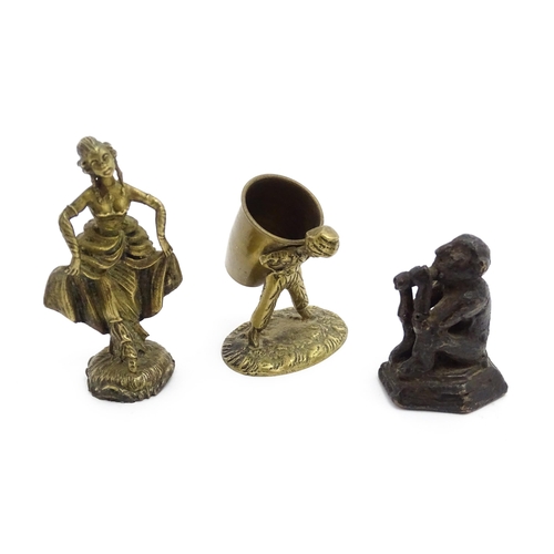 1010 - An Oriental cast model of a seated monkey, possibly a scroll weight. Together with a 20thC brass mat... 