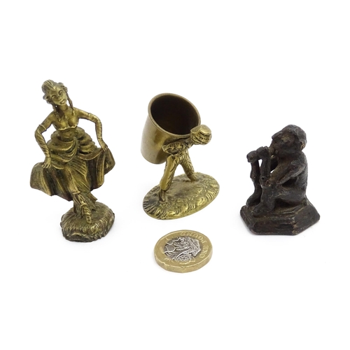 1010 - An Oriental cast model of a seated monkey, possibly a scroll weight. Together with a 20thC brass mat... 