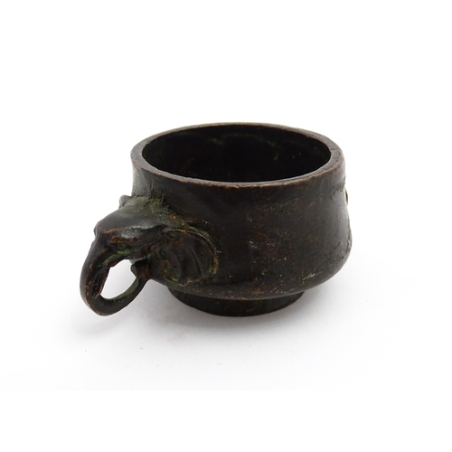 1036 - A small Chinese cast censer with twin elephant handles. Character mark to base. Approx. 3 1/4