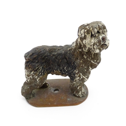 1052 - A 20thC cast model of a standing sheepdog. Dog approx. 3 3/4