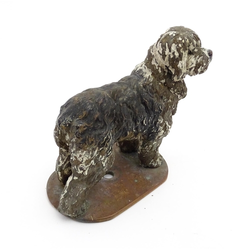 1052 - A 20thC cast model of a standing sheepdog. Dog approx. 3 3/4