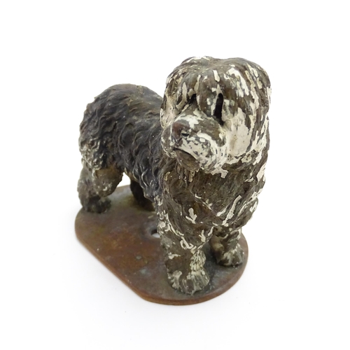 1052 - A 20thC cast model of a standing sheepdog. Dog approx. 3 3/4