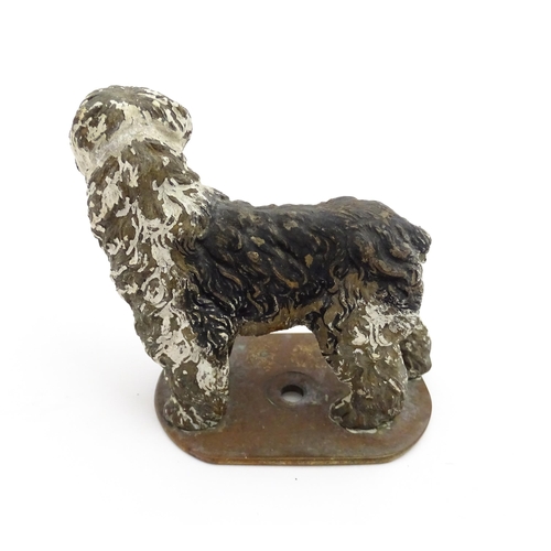 1052 - A 20thC cast model of a standing sheepdog. Dog approx. 3 3/4