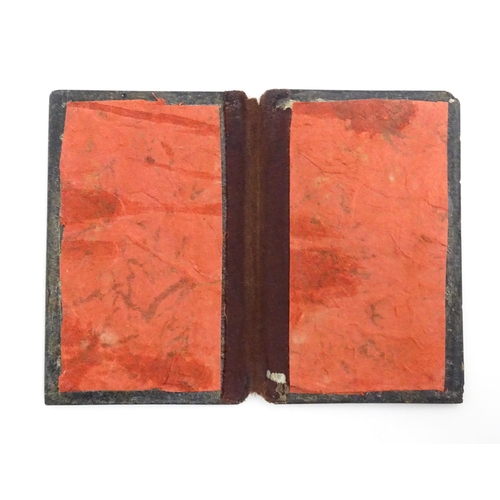 1061 - Two small 20thC Continental notebook covers with inlaid white metal detail. Largest approx. 3 3/4